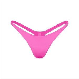 Skims swim thong in taffy